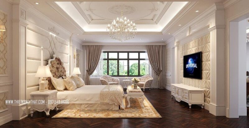 .
Phòng ngủ bố mẹ được thiết kế theo phong cách hoàng gia cao cấp, tráng lệ với giường ngủ tân cổ điển, đèn thả cao cấp, thảm trải sàn họa tiết cổ điển và sofa đơn trong phòng.